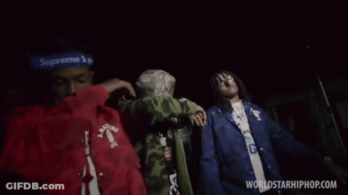 Group Of Men Standing In Dark GIF