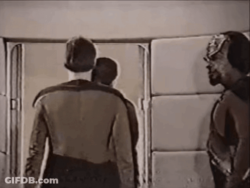 Group Of Men Standing In Front Of Door GIF