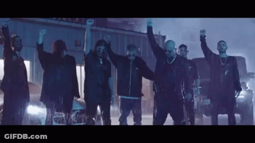 Group Of Men Standing In Line Hands Up GIF