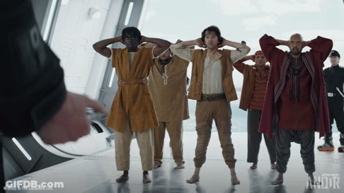 Group Of Men Standing In Room With Andor GIF
