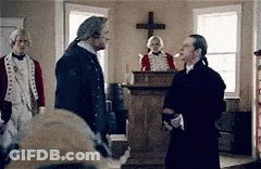 Group Of Men Standing In Room With Cross GIF