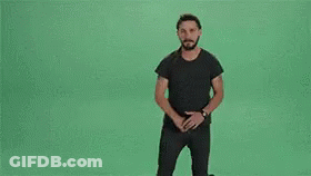Group Of Men Standing On Green Background GIF