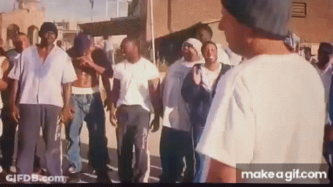 Group Of Men Standing On Sidewalk GIF