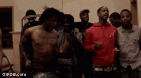 Group Of Men Standing Shirtless In Room GIF