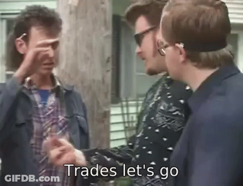 Group Of Men Talking One Pointing At Camera GIF