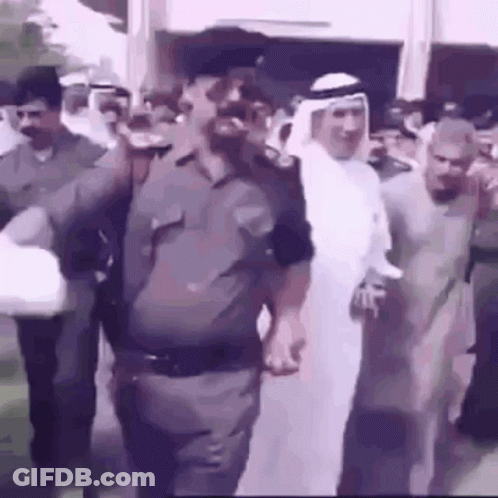 Group Of Men Walking Down Street GIF