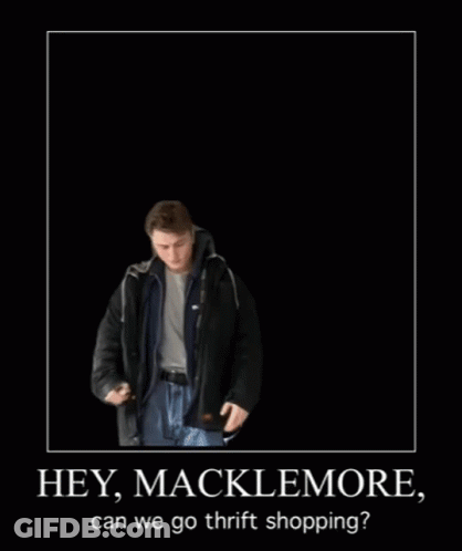 Group Of Men Walking Down Street With Man Sitting On Sidewalk GIF