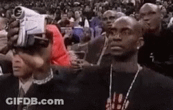 Group Of Men Watching Basketball Game In Stadium GIF