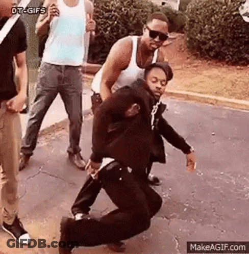 Group Of Men Watching Man Dancing On Street GIF