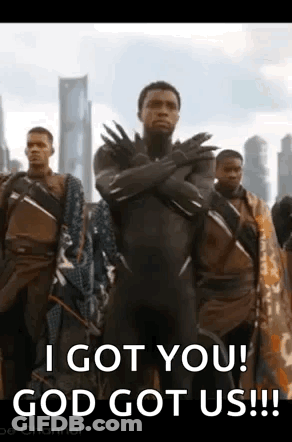 Group Of Men With One In Black Panther Suit GIF