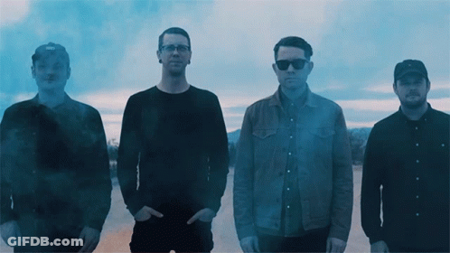 Group Of Men With Smoke Coming Out Of Pockets GIF