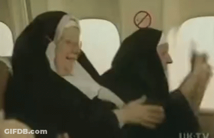 Group Of Nuns Sitting On Plane GIF