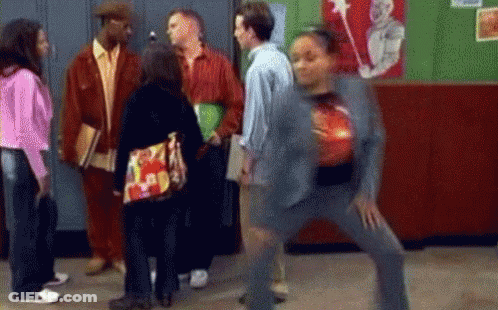 Group Of People And Dancing Woman In Hallway GIF