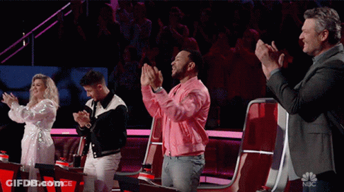 Group Of People Applauding On Stage With NBC Logo GIF