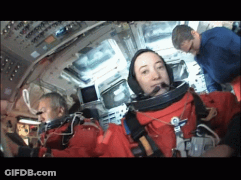 Group Of People Around Giant Inflatable Astronaut Balloon GIF