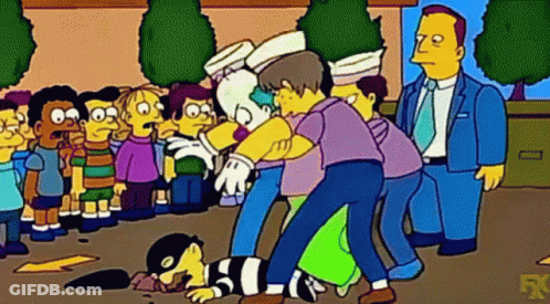 Group Of People Around Lying Man GIF
