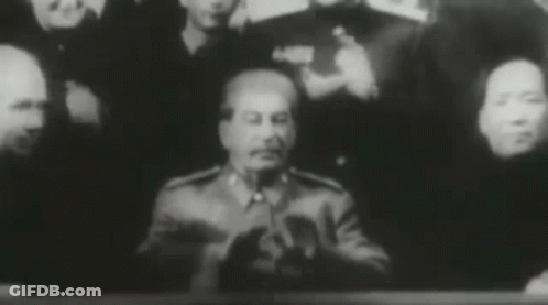 Group Of People Around Man In Military Uniform GIF