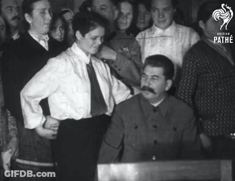 Group Of People Around Mustached Man GIF