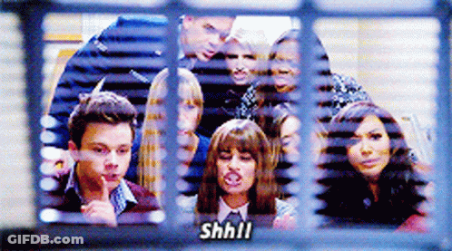 Group Of People Behind Window Saying Shhll GIF