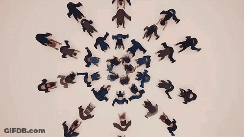 Group Of People Dancing Around Letter T GIF
