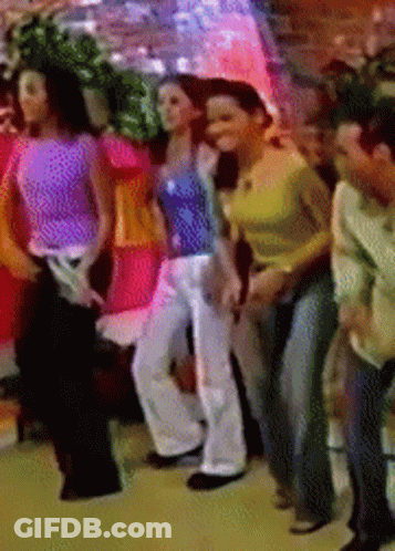 Group Of People Dancing In A Line GIF