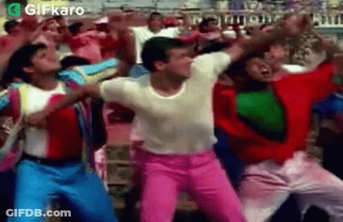 Group Of People Dancing In A Stadium Crowd GIF