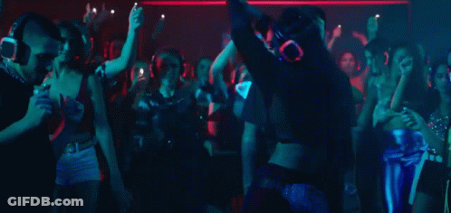 Group Of People Dancing In Club Wearing Masks GIF