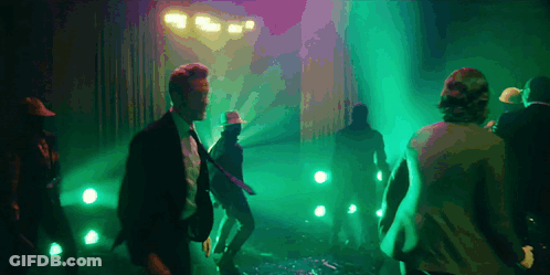 Group Of People Dancing In Dark Room GIF