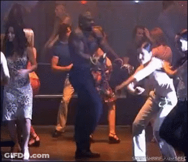 Group Of People Dancing In Dark Room Saying Spec GIF