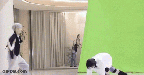 Group Of People Dancing In Front Of Green Screen GIF
