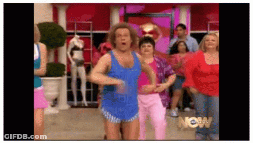 Group Of People Dancing In Front Of Now Sign GIF