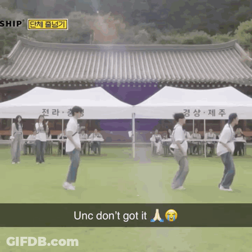 Group Of People Dancing In Front Of Ship Building GIF