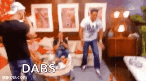 Group Of People Dancing In Living Room With Word Dabs GIF