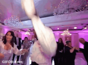 Group Of People Dancing In Pink Lights GIF
