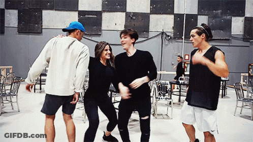 Group Of People Dancing In Room With Chairs GIF