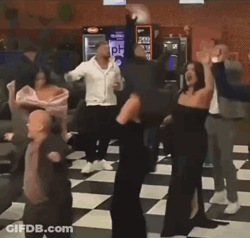 Group Of People Dancing In Room With Checkered Floor GIF