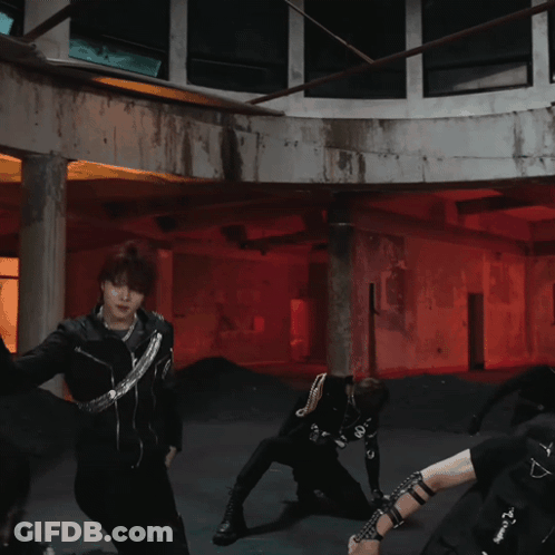 Group Of People Dancing In Room With Red Lights GIF