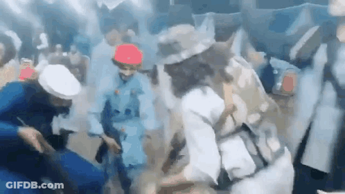 Group Of People Dancing In Smoky Room GIF
