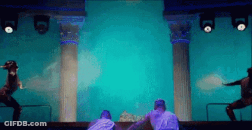 Group Of People Dancing On Blue Stage GIF