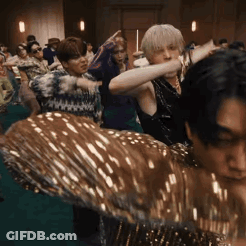 Group Of People Dancing On Green Floor GIF