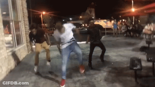 Group Of People Dancing On Sidewalk GIF