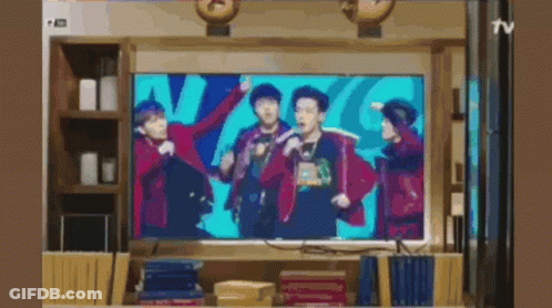 Group Of People Dancing On TV Screen GIF