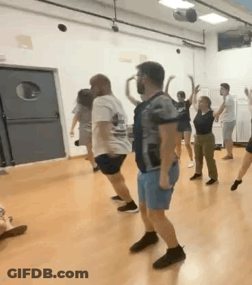 Group Of People Dancing Together GIF