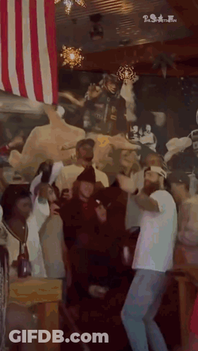 Group Of People Dancing With American Flag GIF