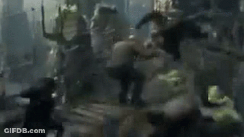 Group Of People Fighting In Blurred Scene GIF