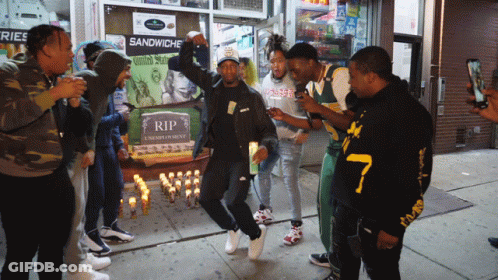 Group Of People Gathered In Front Of Rip Sign GIF