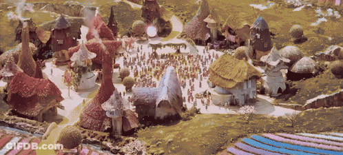 Group Of People Gathered In Small Village GIF