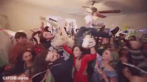 Group Of People Having A Party In Living Room GIF
