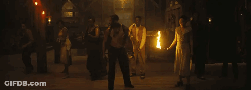 Group Of People Holding Fire Torches GIF