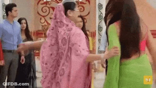 Group Of People Holding Hands In A Room GIF